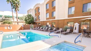 A hotel pool area with two hot tubs and lounge chairs. - Sleep Inn North Scottsdale near Mayo Clinic (Scottsdale)