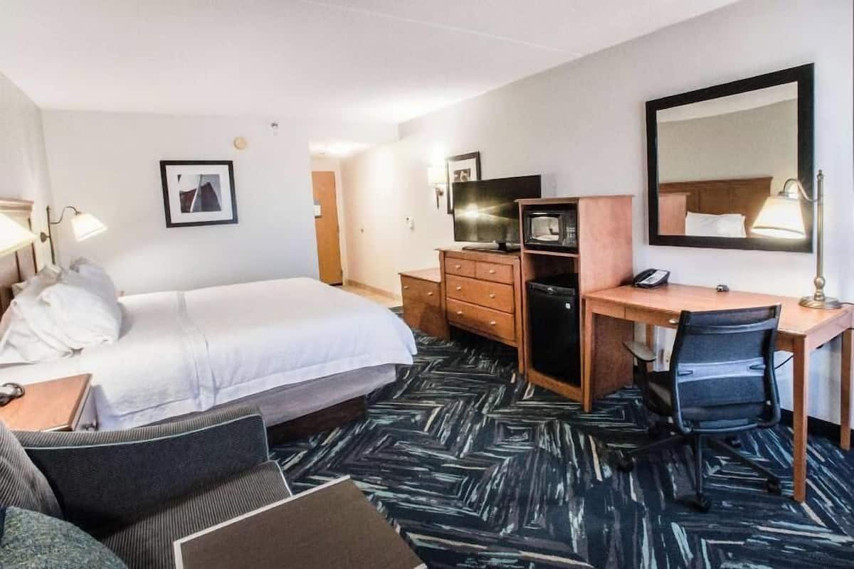 Hypo-allergenic bedding, desk, laptop workspace, blackout curtains