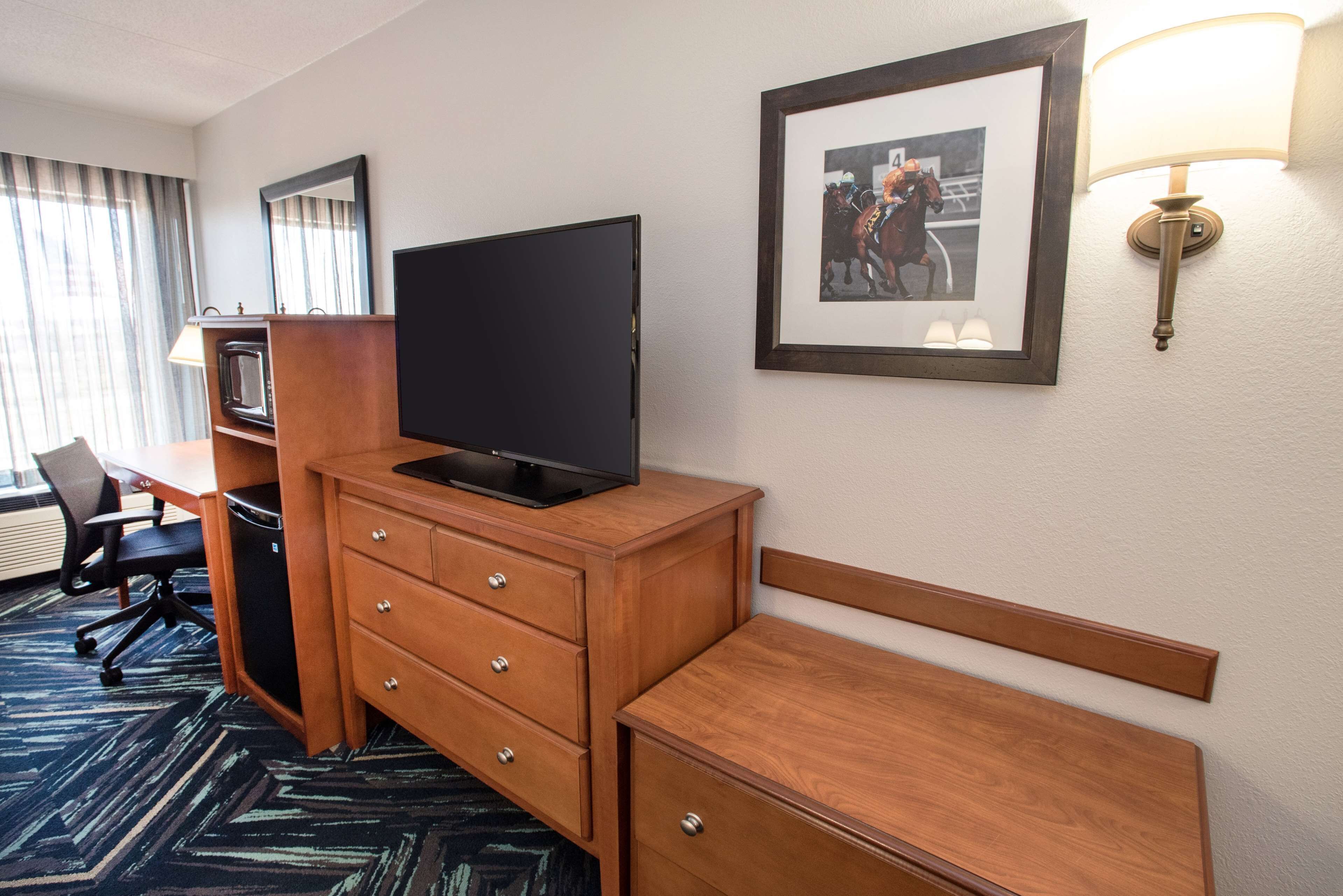 hypo-allergenic bedding, desk, laptop workspace, blackout curtains