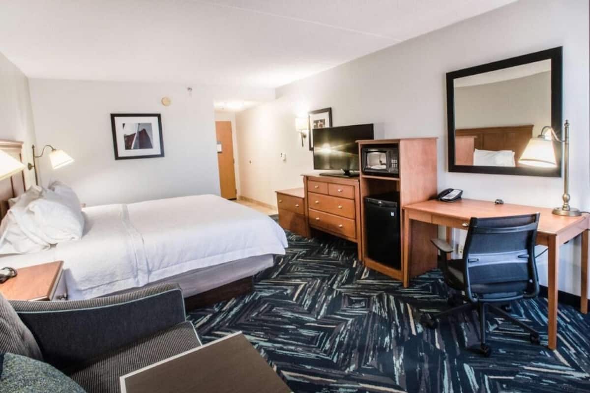 Hypo-allergenic bedding, desk, laptop workspace, blackout curtains