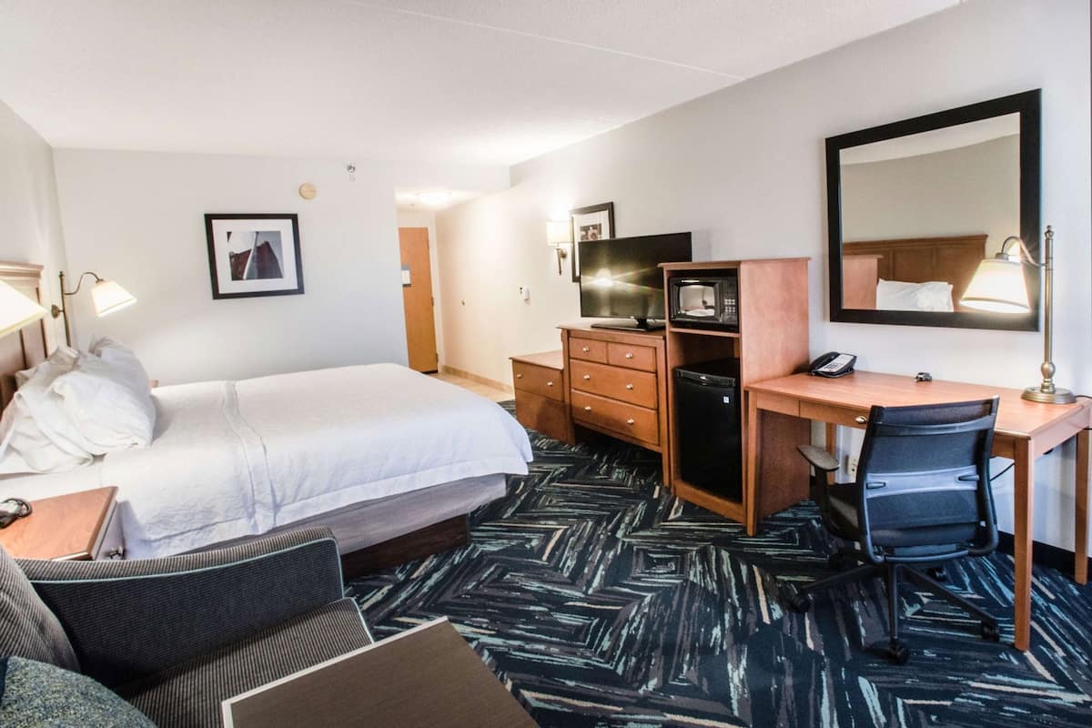 Hypo-allergenic bedding, desk, laptop workspace, blackout curtains