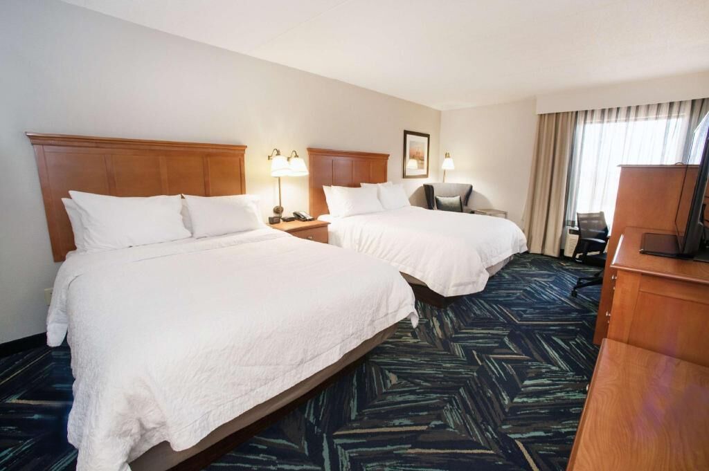 Hypo-allergenic bedding, desk, laptop workspace, blackout curtains