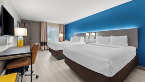 A hotel room with two beds, a desk, a chair, and a TV. - Comfort Inn & Suites Perry National Fairgrounds Area (Perry)