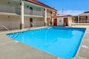 Seasonal outdoor pool, pool umbrellas, pool loungers