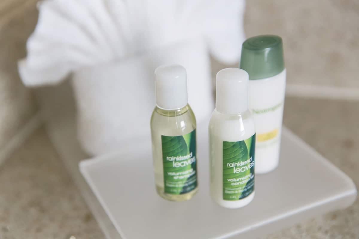 hypo-allergenic bedding, desk, laptop workspace, blackout curtains