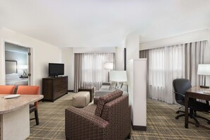 Hypo-allergenic bedding, desk, laptop workspace, blackout drapes
