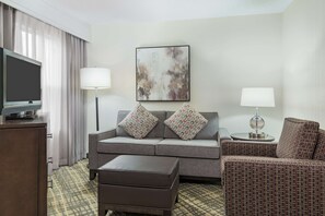 Studio Suite, 1 Queen Bed | Living area | 32-inch LCD TV with cable channels, TV