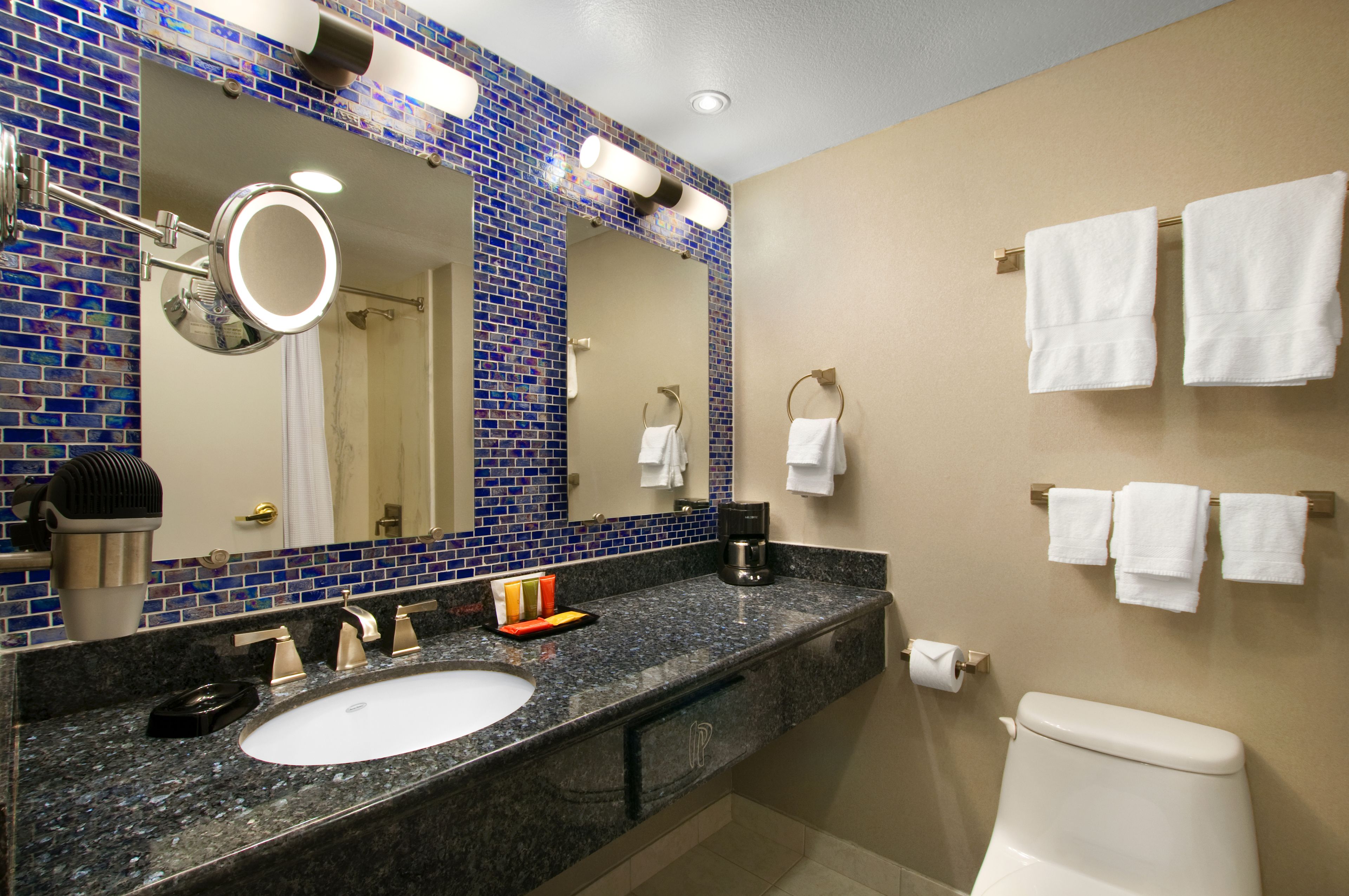 eco-friendly toiletries, hair dryer, towels