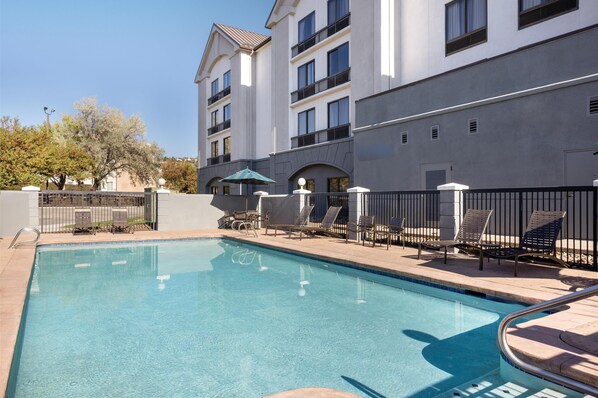 Outdoor pool, open 6:00 AM to 10:00 PM, pool umbrellas, sun loungers