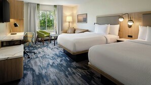 A hotel room with two beds, a desk, a chair, a TV, and a window with curtains. - Fairfield Inn & Suites By Marriott - Brunswick (Brunswick)