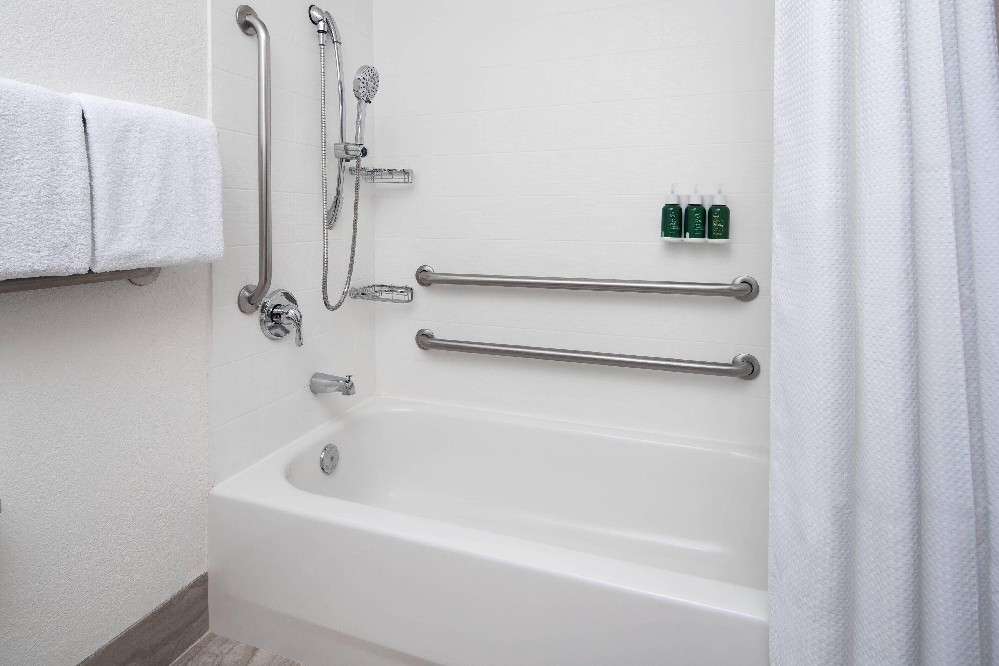 studio suite, 1 king bed with sofa bed (mobility/hearing accessible, tub) | bathroom | combined shower/bathtub, free toiletries, hair dryer, towels