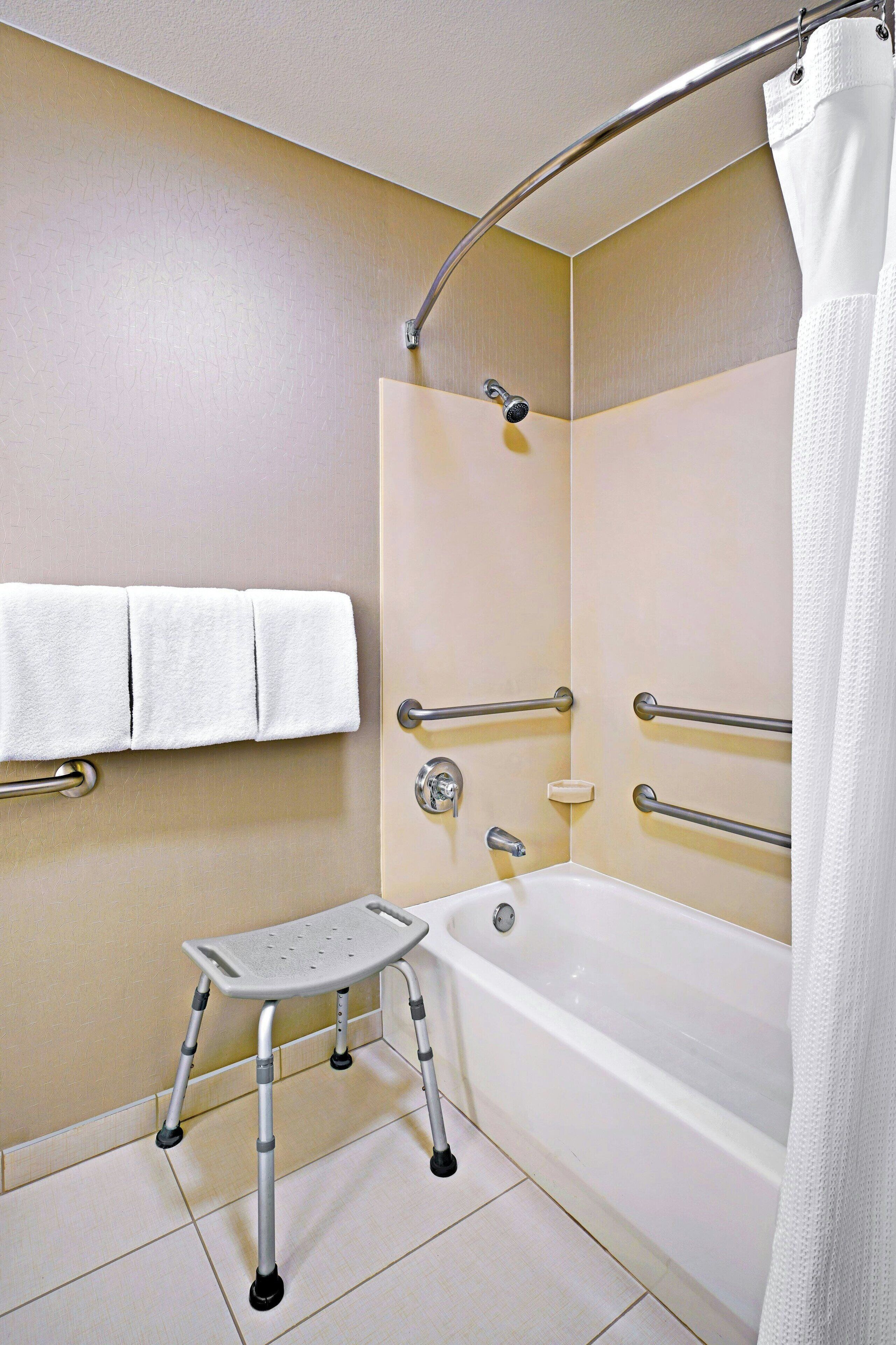 suite, 1 king bed with sofa bed, non smoking | bathroom | combined shower/bathtub, hair dryer
