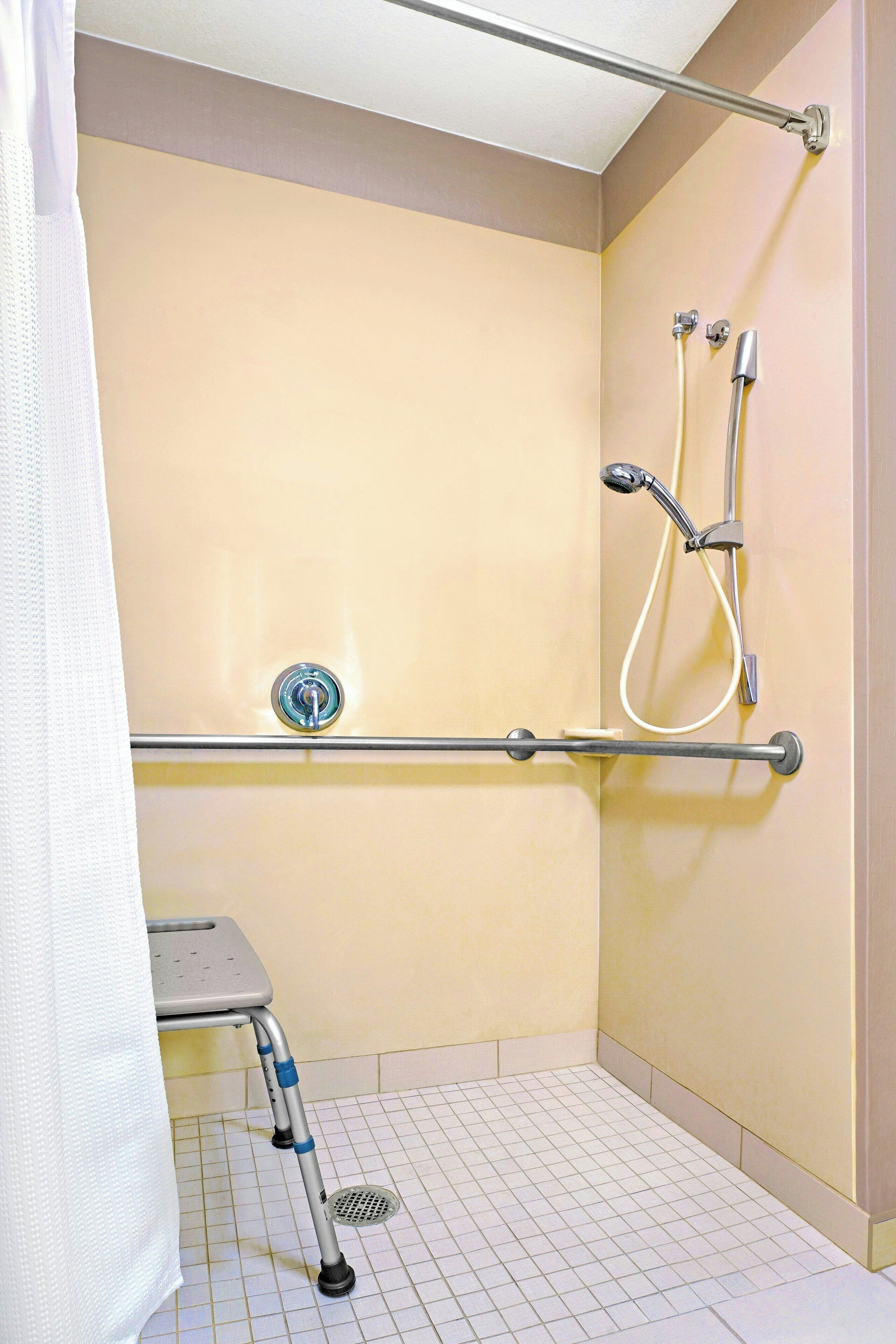 suite, 1 king bed with sofa bed, non smoking | bathroom | combined shower/bathtub, hair dryer