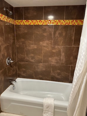 Suite, 1 King Bed, Non Smoking | Bathroom | Free toiletries, hair dryer, towels