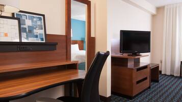 Premium bedding, desk, laptop workspace, blackout drapes