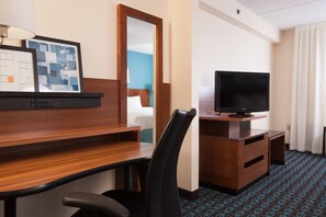 Premium bedding, desk, laptop workspace, blackout curtains