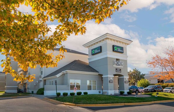 Stay America hotel features a modern two-story design with a clear entrance pathway and landscaped area.