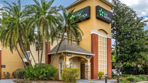 A hotel with a sign reading "Extended Stay America" and a lobby entrance. - Extended Stay America Select Suites Tampa North Airport (Tampa)