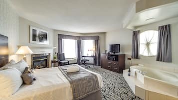 Queen Suite with Jetted Tub | In-room safe, desk, laptop workspace, blackout curtains