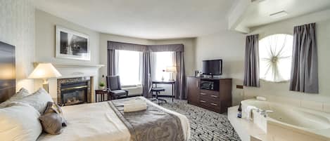 Queen Suite with Jetted Tub | In-room safe, desk, laptop workspace, blackout curtains