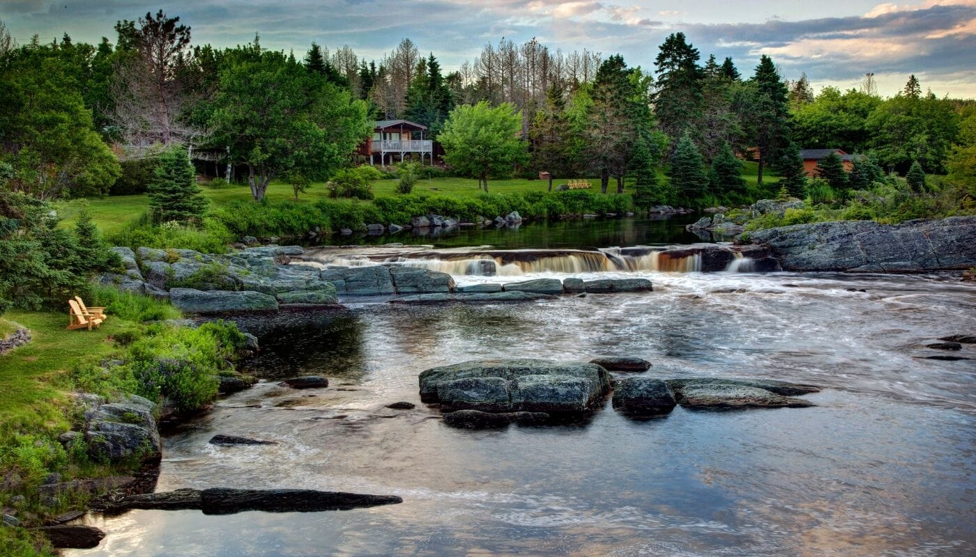 Classic Chalet, Multiple Beds, Fireplace, River View | Down duvets, in-room safe, blackout curtains, iron/ironing board