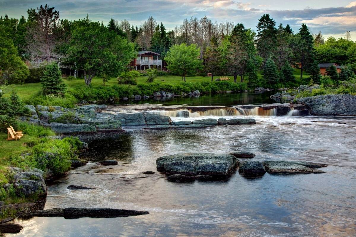 Classic Chalet, Multiple Beds, Fireplace, River View | Down comforters, in-room safe, blackout drapes, iron/ironing board