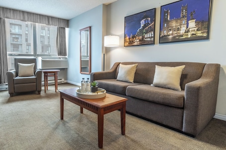 Suite, 1 Queen Balcony, Kitchen | Living area | 42-inch TV with cable channels