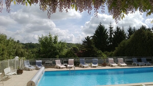 Seasonal outdoor pool, pool loungers