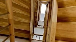 A wooden interior with a sloped ceiling and a central aisle. - Hotel St-Etienne (Lourdes)
