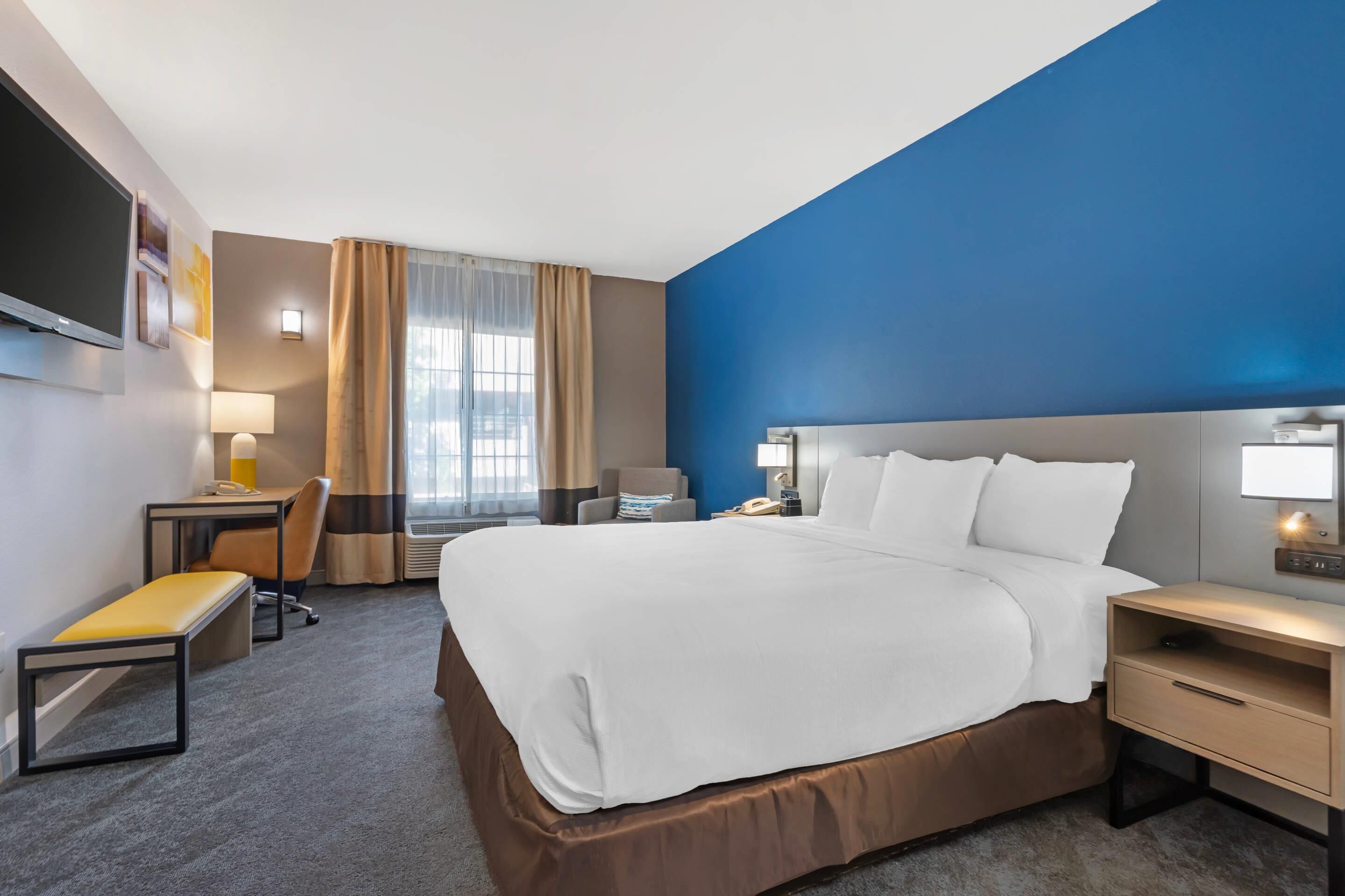 Premium bedding, desk, blackout drapes, iron/ironing board