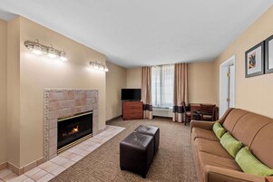 Suite, 1 King Bed with Sofa bed, Non Smoking, Jetted Tub (Living Room) | Desk, laptop workspace, blackout drapes, soundproofing