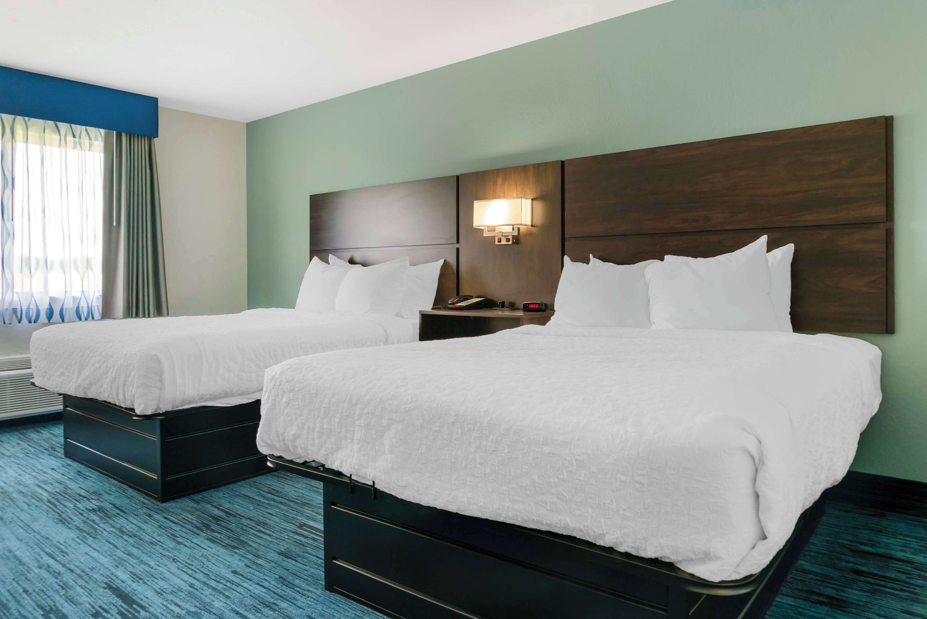 standard room, 2 queen beds, non smoking, refrigerator | 1 bedroom, individually furnished, desk, blackout curtains