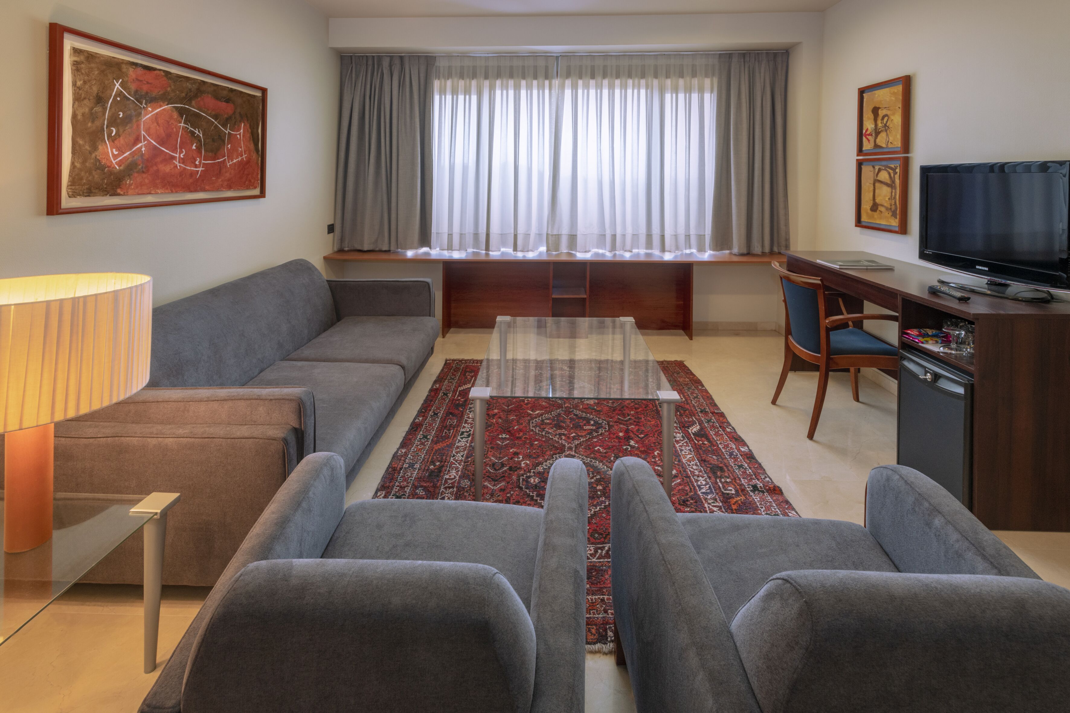 premium room | living area | plasma tv