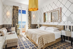 Habitación Deluxe, vista al mar | Ropa de cama de alta calidad y minibar 