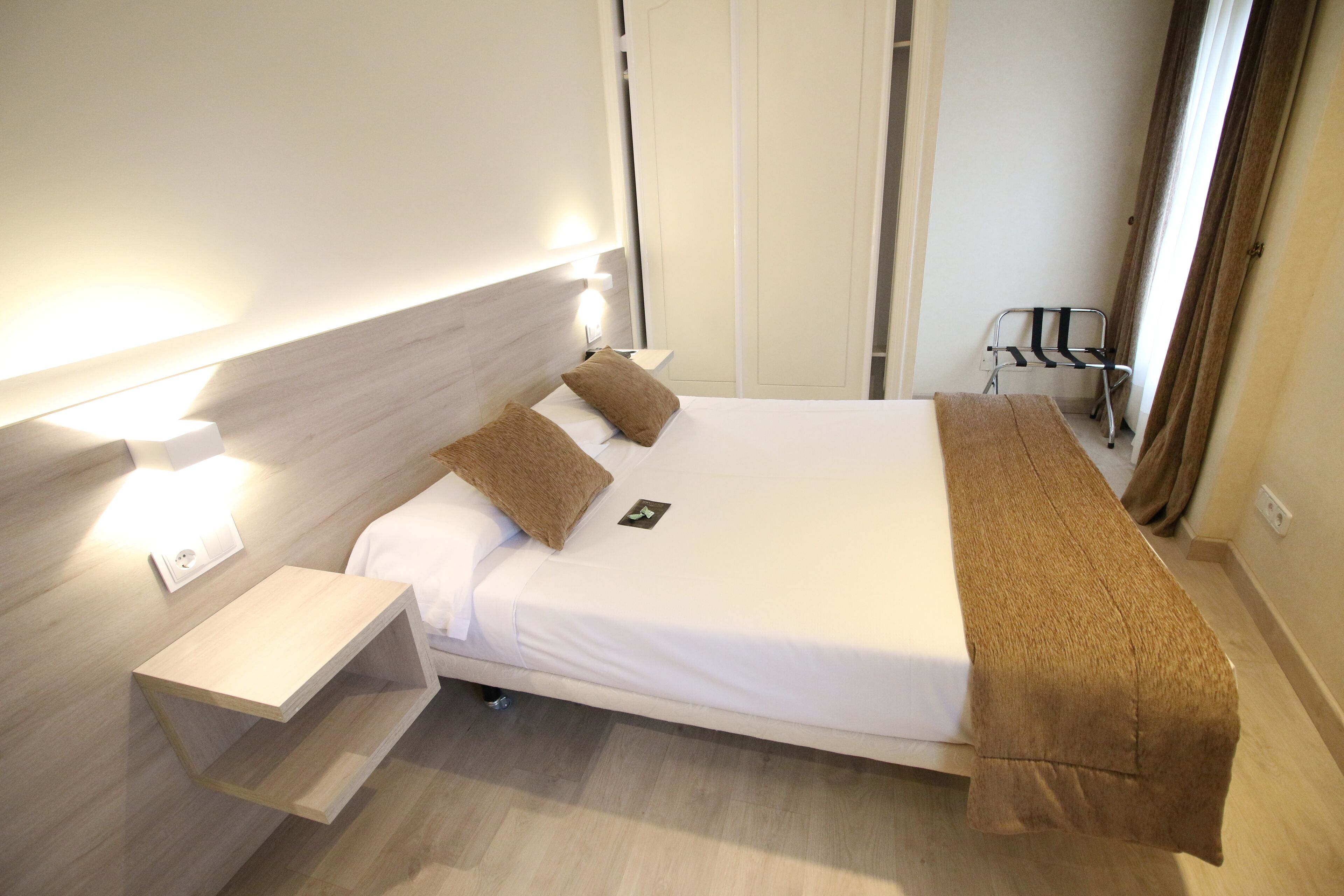 Premium bedding, desk, laptop workspace, blackout curtains