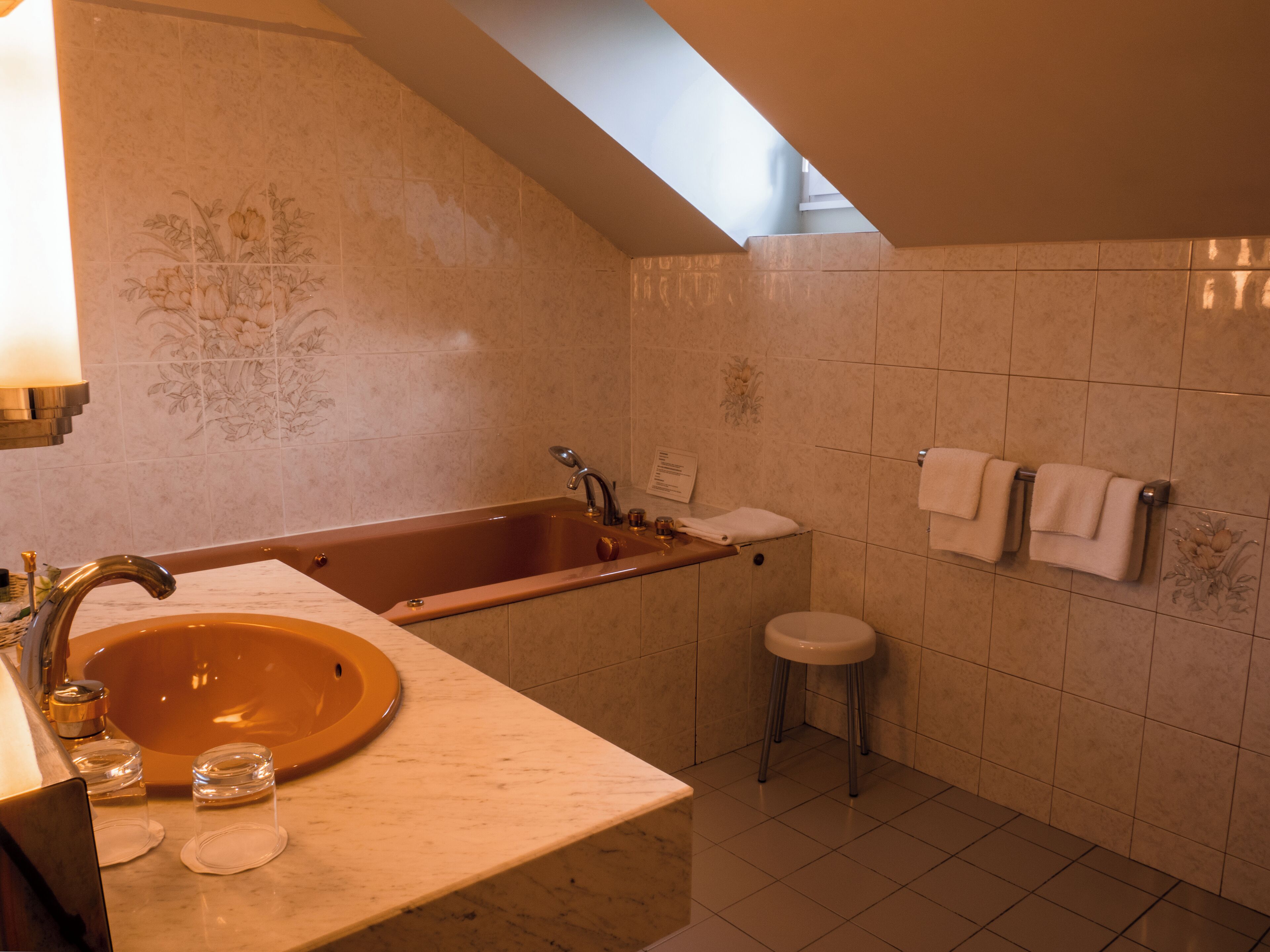 A bathroom with a bathtub, sink, and toilet.