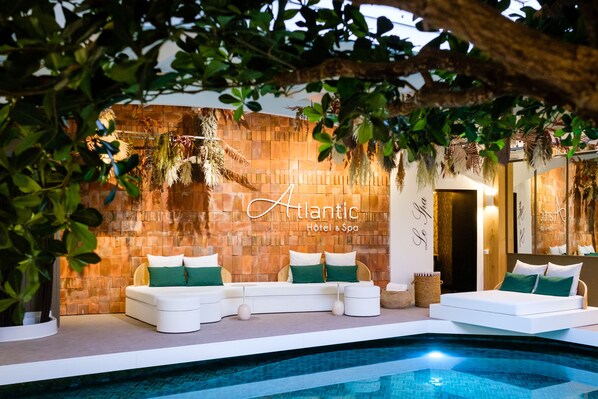 Indoor pool, open 10:30 AM to 7:00 PM, pool loungers