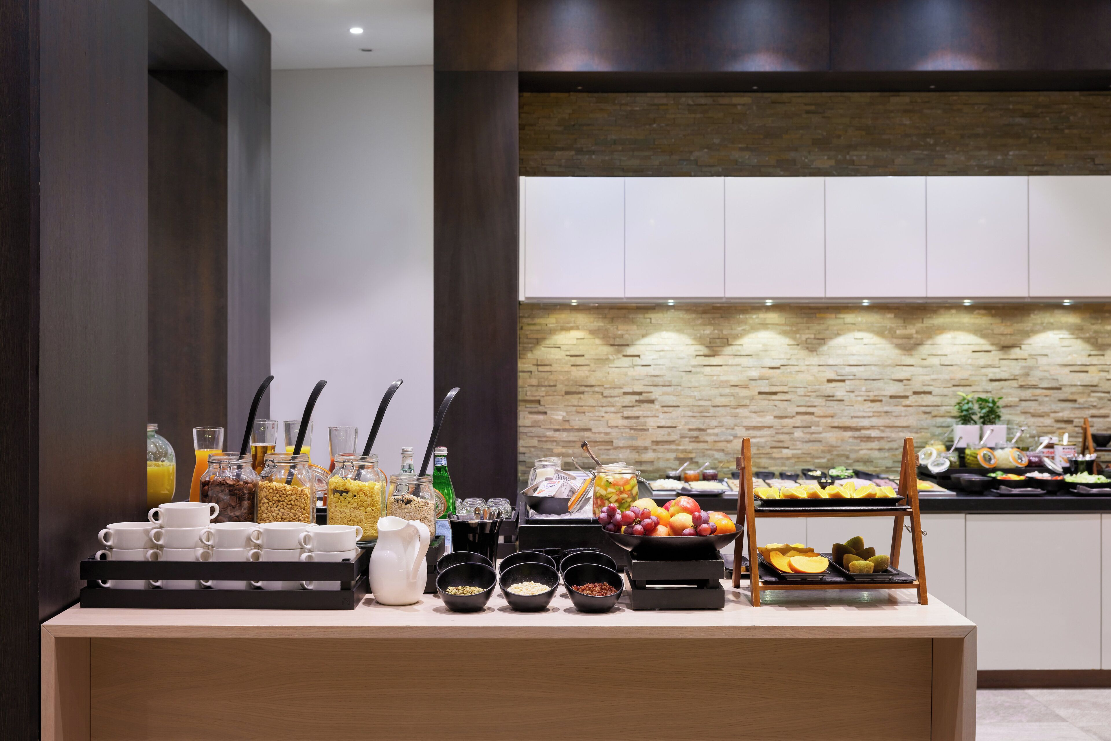 A breakfast buffet with various food items and beverages.