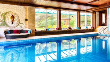 Indoor pool, open 7:00 AM to 8:00 PM, pool loungers
