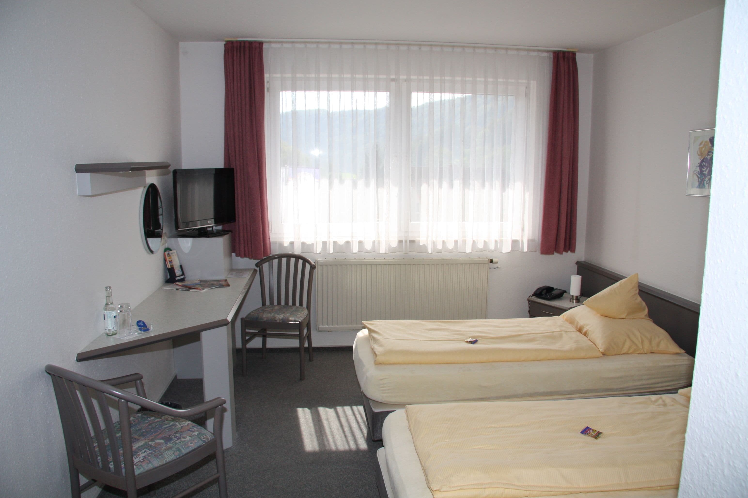 standard double room | in-room safe, individually decorated, desk, iron/ironing board