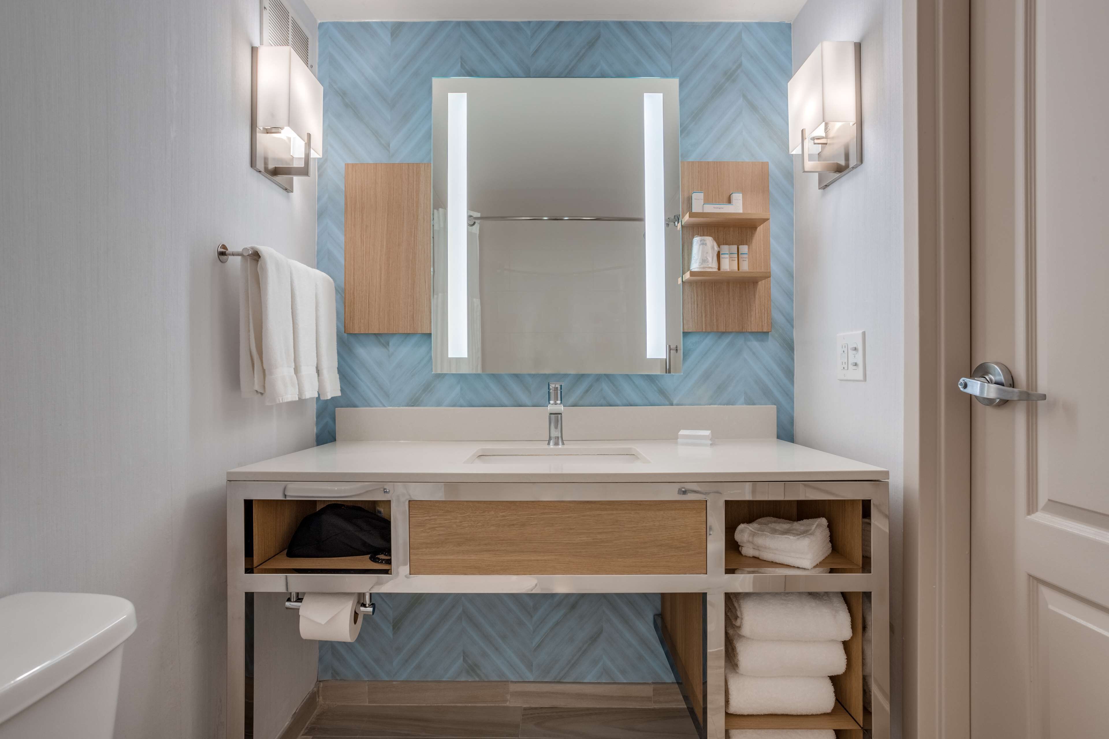 combined shower/bathtub, designer toiletries, hair dryer, towels