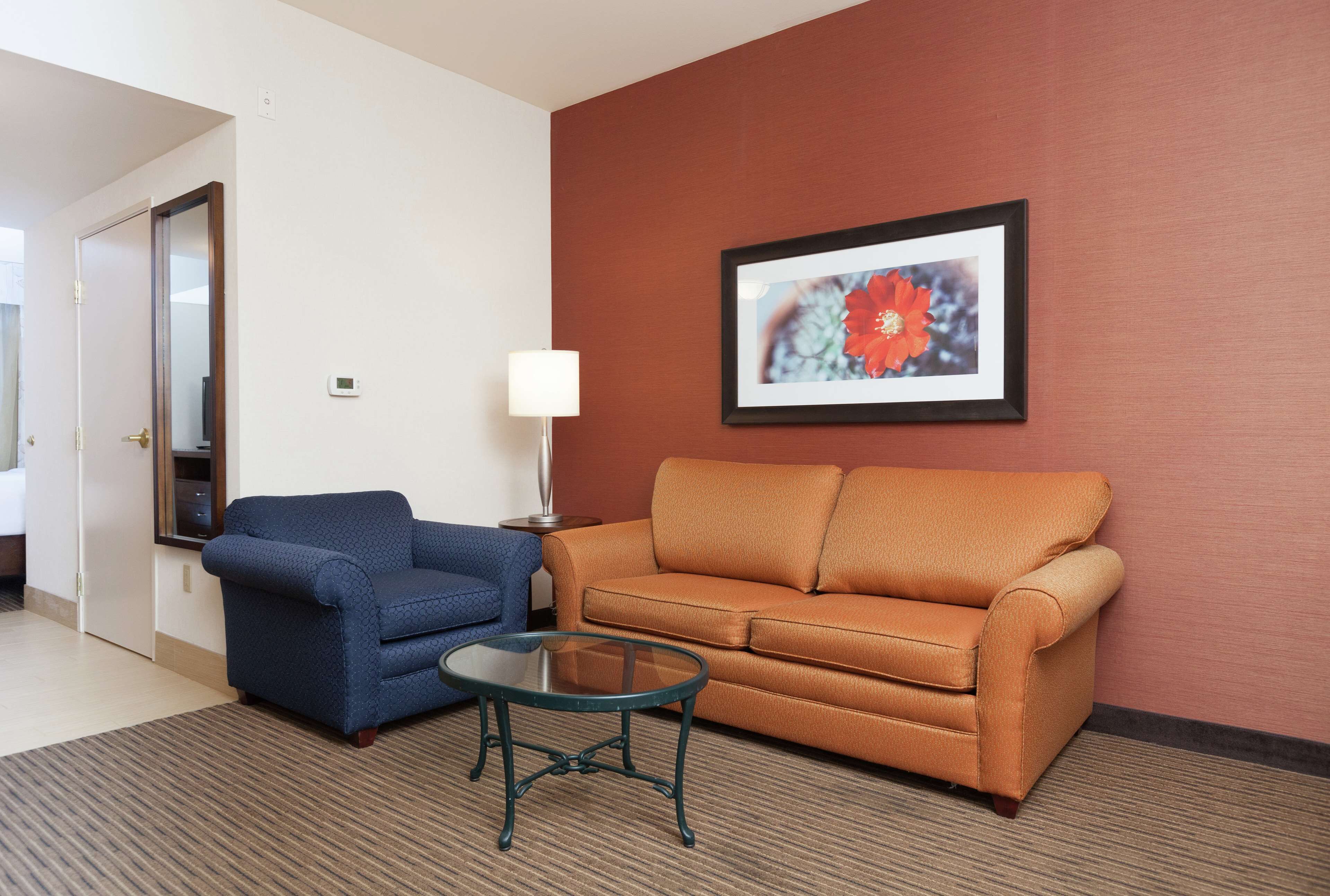 suite, 1 bedroom, pool view | living area | 37-inch flat-screen tv with cable channels, tv, mp3 dock