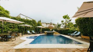 Outdoor pool, open 9:00 AM to 7:00 PM, pool umbrellas, pool loungers