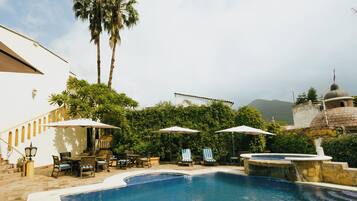 Outdoor pool, open 9:00 AM to 7:00 PM, pool umbrellas, pool loungers