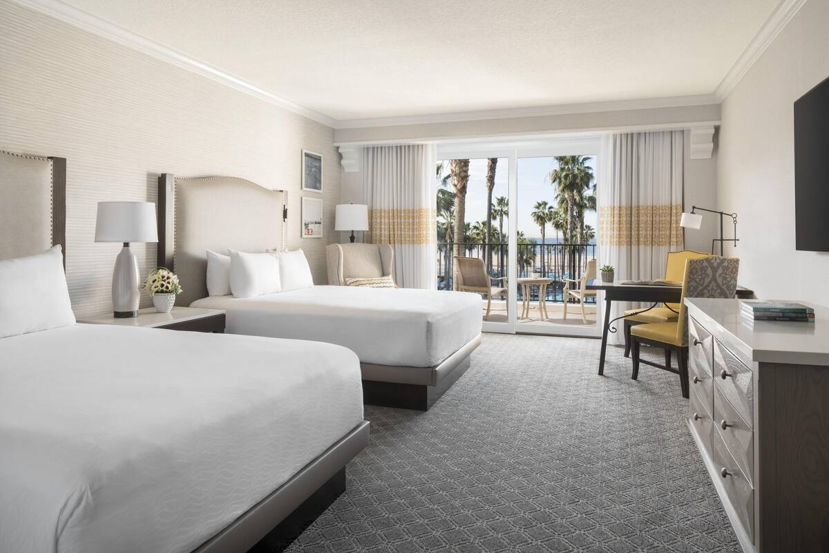 Deluxe Room, 2 Queen Beds, Partial Ocean View | Hypo-allergenic bedding, down duvets, pillow-top beds, in-room safe