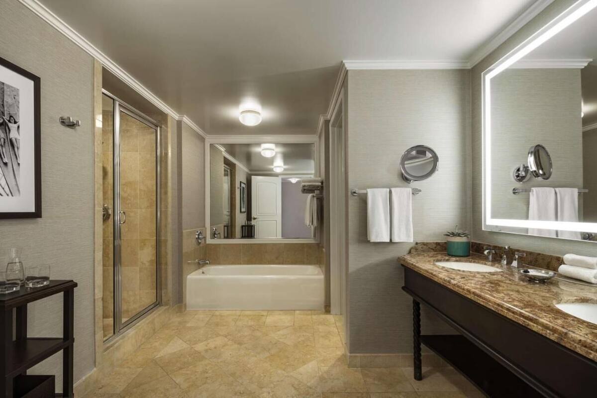 Bathroom | Combined shower/bathtub, designer toiletries, hair dryer, bathrobes