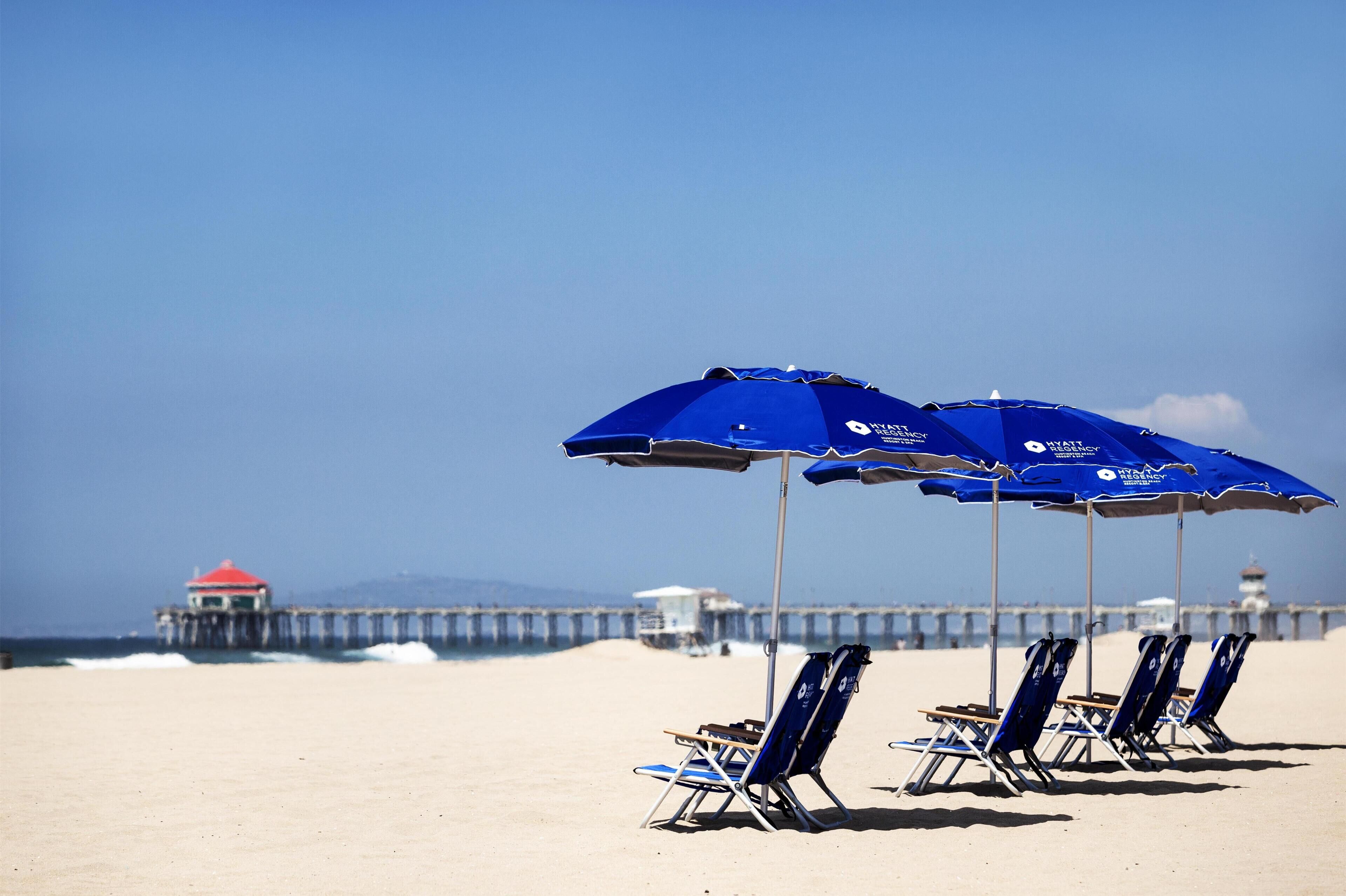On the beach, sun loungers, beach umbrellas, beach towels