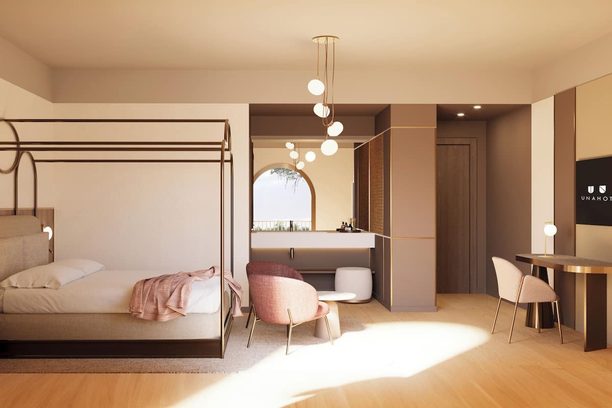 A modern bedroom with a bed, a desk, and a chair.