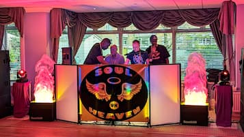 A DJ booth with a logo reading "SOUL HEAVEN UK" and two SoundLab speakers on either side.
