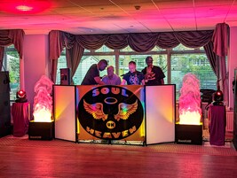 A DJ booth with a logo reading "SOUL HEAVEN UK" and two SoundLab speakers on either side.